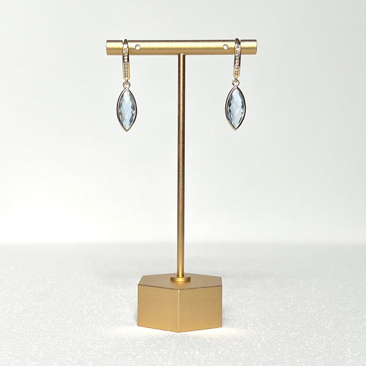 This earring pair features a crystal blue glass marquise bezel charm hung on a gold filled CZ channel set French hook earring.